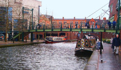 The Birmingham Canal Navigations between the International Convention Centre (left) and Brindleyplace (right) in central Birmingham.