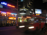 A private bus speeding through the streets of Kochi