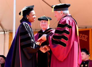 Rice makes an appearance at Boston College, where she is greeted by Father William Leahy.  Some attendees protested during her speech over disagreements on the War on Terror.