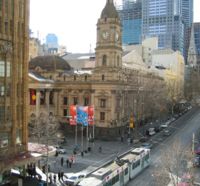 The Melbourne Town Hall from the western side of Swanston Street looking towards the eastern end of Collins Street.