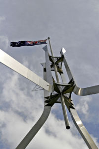 The flagpole on Parliament House is 81 metres tall and the flag measures 12.8�m by 6.4�m, about the size of half a tennis court.