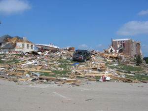 An example of F3 damage.  Here, the roof and some inner walls of this brick building have been demolished.