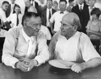 Clarence Darrow and William Jennings Bryan chat in court during the Scopes trial.