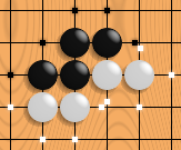 This picture shows one black unit and two white units. Their respective liberties are shown with dots. Note that liberties are shared among all the stones of a unit. If White plays where his two units share a liberty, they will be connected into one.