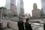 President George W. Bush and Laura Bush look over the World Trade Center site during a visit to Ground Zero in New York City to mark the fifth anniversary of the September 11 terrorist attacks.