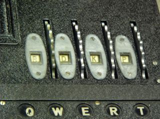 Figure 2. With the inner lid placed down, the Enigma is ready for use. The finger wheels of the rotors protrude through the lid, allowing the operator to set the rotors, and the current position — here RDKP — is visible to the operator through a set of windows.