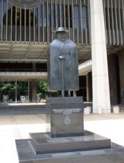 This statue of Father Damien sits outside the entrance to the Hawaiʻi State Capitol Building on the island of Oʻahu.