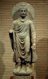 The Buddha, in Greco-Buddhist style, 1st-2nd century AD, Gandhara. (Standing Buddha (Tokyo National Museum)).