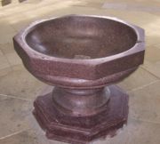 Baptismal Font made of rose porphyry.