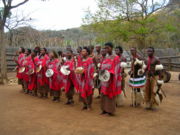 Swazis dancing in a cultural village show.