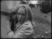 Barbra (Judith O'Dea) watches in horror while her brother is attacked in the cemetery.