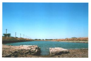 The dock, with a canal opening to allow water to flow into the river, thereby maintaining a stable water level.