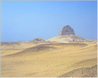 Sneferu's Pyramid at Meidum; the central core structure remains, surrounded by a mountain of rubble from the collapsed outer casing