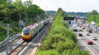 The West Coast Main Line railway, alongside the M1 motorway