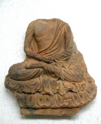 Tile with seated Buddha, Nara Prefecture, Asuka period, 7th century. Tokyo National Museum.