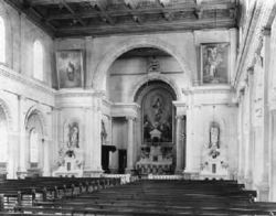 In the classically simple interior of "The Sacred Heart", the altar is given prominence by Serlian arches.The columns in the nave are ionic, supporting a clerestory.