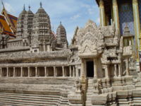 A model of Angkor Wat prior to its ruin shows the half-galleries of the lower level and intact towers at the corners of the second-level galleries.