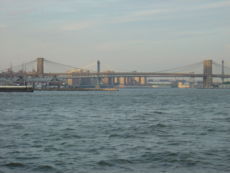 Southern view of the Brooklyn, Manhattan, and Williamsburg bridges (front to back), seen from the East River.