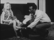 A scene that portrays Barbra as helpless. Ben puts slippers on her feet as she is catatonic.