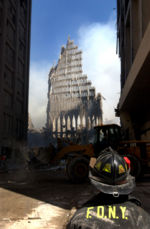 September 13, 2001: A New York City firefighter looks up at what remains of the South Tower.