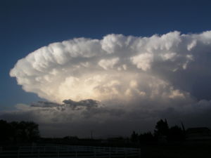 A supercell forming a thunderstorm with an associated strong updraft and a heavy precipitation of hail.