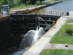 Upstream view of the downstream lock (Lock 32, Pittsford, NY) showing gushing water.