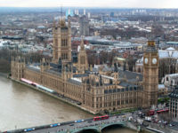 The Palace of Westminster, on the banks of the River Thames, London, houses the Parliament of the United Kingdom.