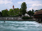 Surfing in the wake of the Upper Sluice, Thun, Switzerland