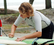 Waxing a surfboard