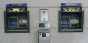 Twin cash machines at a bank which dispensed a choice of Bank of England or Jersey banknotes. Since the intervention of the Treasurer of the States in 2005, cash machines generally (with the exception of those at the Airport and Elizabeth Harbour) no longer dispense English notes.