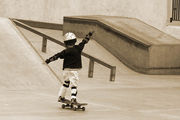 A child learning to skateboard