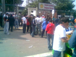 Voters concentrate in a voting center during the legislative elections of 2006. As a rule, voters are not allowed to wear political propaganda in allusion to a candidate or party, or have electronic devices on their possession while voting.