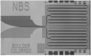 Josephson junction array chip developed by NIST as a standard volt.