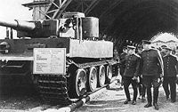 Marshal Zhukov and Colonel General Nikolai Voronov, commander of Red Army Artillery, (front row left to right) inspect a German Tiger tank captured near Leningrad.