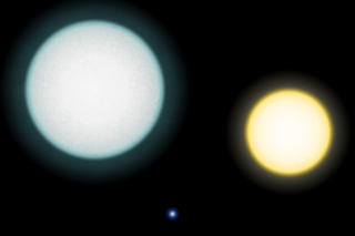 A comparison between the white dwarf IK Pegasi B (center), its A-class companion IK Pegasi A (left) and the Sun (right). This white dwarf has a surface temperature of 35,500�K.