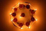 A circular arrangement of diyas.