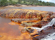 The red appearance of this water is due to iron in the rocks.