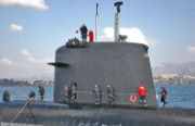 Sail of the French nuclear submarine Casabianca; note the diving planes, camouflaged masts, periscope, electronic warfare masts, door and windows.