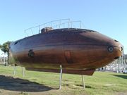 A replica of Monturiol's wooden Ictineo II stands near Barcelona harbor.