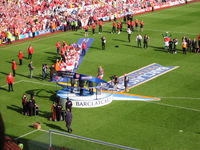 Arsenal captain Patrick Vieira lifts the 2003–04 Premier League trophy.