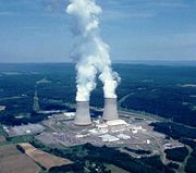 The Susquehanna Steam Electric Station, a boiling water reactor. The nuclear reactors are located inside the rectangular containment buildings towards the front of the cooling towers. The towers in the background vent water vapor.