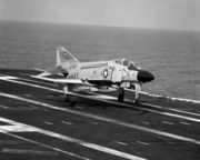 A US Navy F-4J Phantom of VF-31 lands on the USS Saratoga.