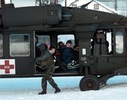 A Blackhawk helicopter as the crew prepares to evacuate tourists stranded by an avalanche in Galt�r, Austria, on February 25, 1999.