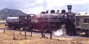 Restored Southern Pacific Lines No. 2353, a 4-6-0 oil-burning steam locomotive built by the Baldwin Locomotive Works in 1912. The cylindrical tender, specifically designed to carry fuel oil, was a signature feature of the railroad.