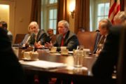 Flanked by Michael Chertoff, Secretary of Homeland Security, left, and former Secretary of Defense Donald Rumsfeld, President George W. Bush meets with members of the White House Task Force on Hurricane Katrina Recovery on August 31, 2005, in the Cabinet Room of the White House.