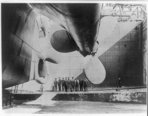 The RMS Titanic, Northern Ireland's most famous manufacturing export, being admired by Harland and Wolff shipyard workers before its launch.