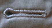 Machine-stitched keyhole buttonhole with bar