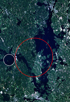 Keurusselk� - Landsat 7 image of the Keurusselk� region. Area where shatter cones have been found is marked with a red ellipse and the suggested impact structure of Ukonselk� is marked with a white circle.