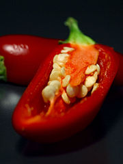 A ripe red jalape�o cut open to show the seeds