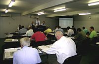 Wool buyers' room at a wool auction, Newcastle, NSW.